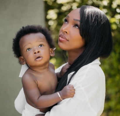 Image of an American actress and TV personality, Malika Haqq with son