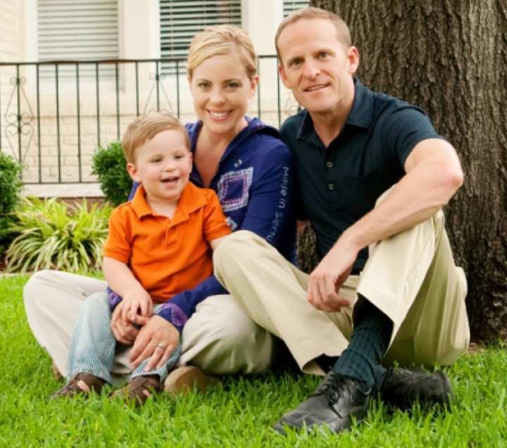 Grant Stinchfield with his girlfriend, Amy and his son