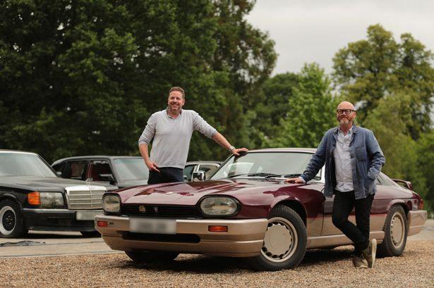 Drew Pritchard and his partner posing with car